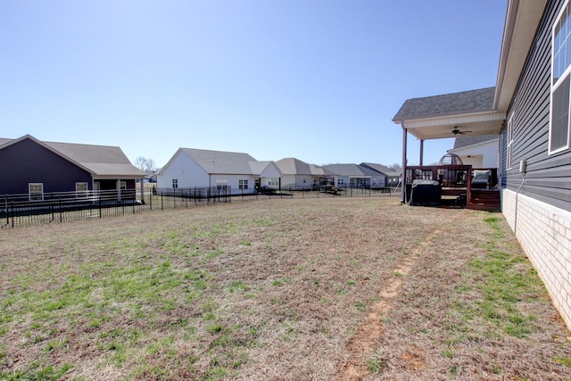 view of yard featuring a residential view and fence