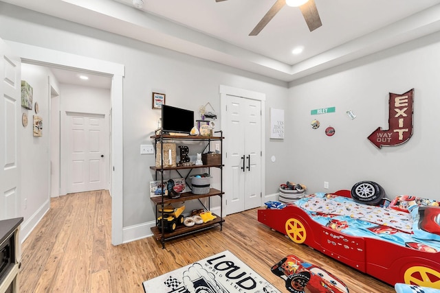 bedroom featuring ceiling fan and light wood-type flooring