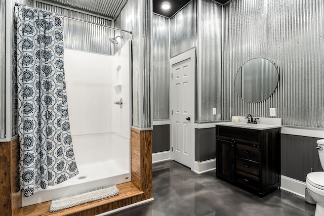 bathroom with vanity, toilet, concrete floors, and a shower