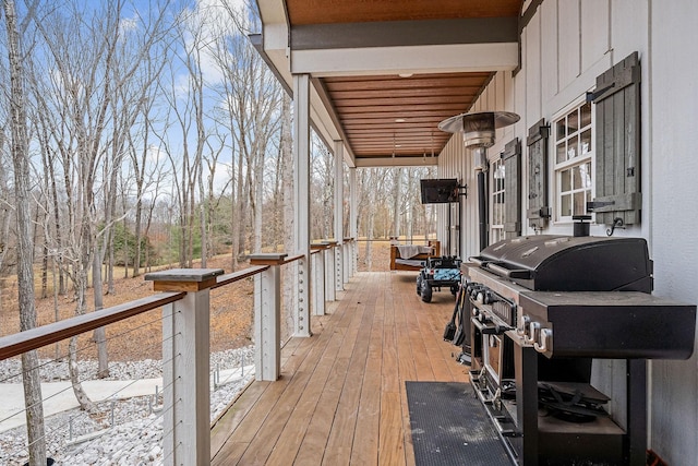 wooden terrace featuring grilling area