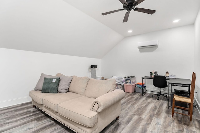 living room with a wall mounted air conditioner, hardwood / wood-style flooring, vaulted ceiling, and ceiling fan