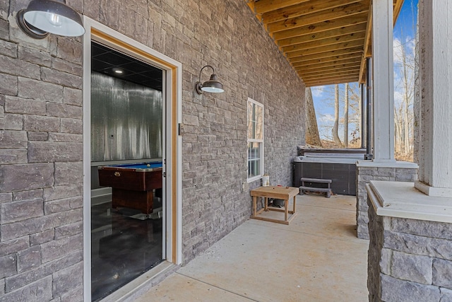 view of patio with a hot tub