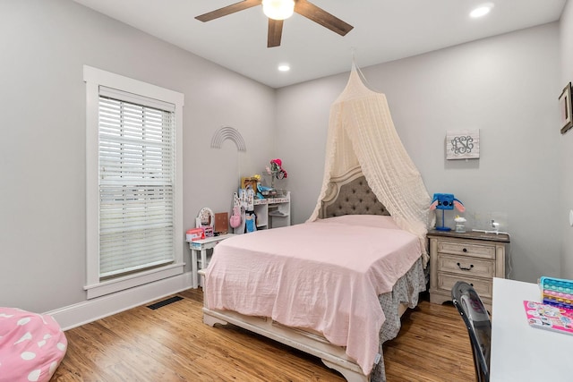 bedroom featuring ceiling fan and light hardwood / wood-style floors