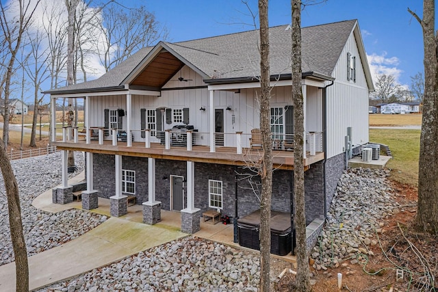 view of front facade with a deck and a patio area