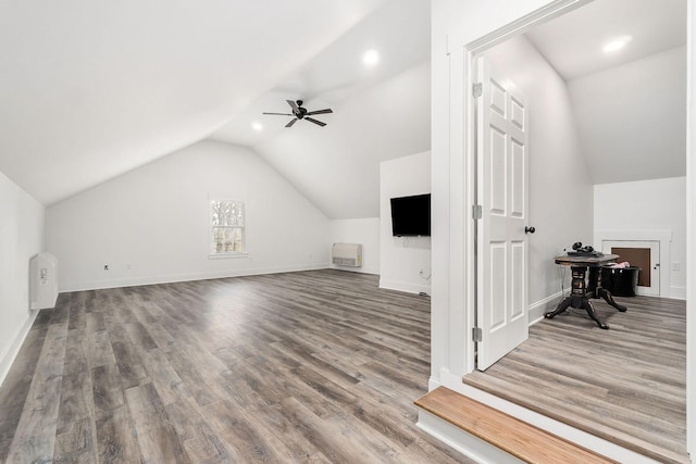 bonus room with wood-type flooring, ceiling fan, and vaulted ceiling