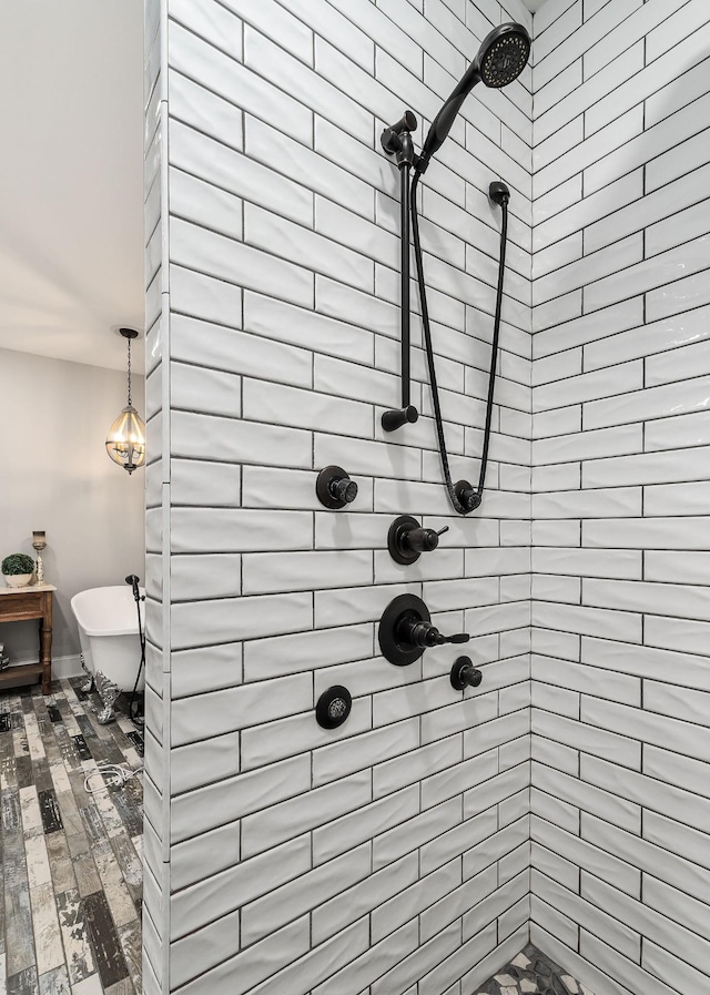 bathroom with a tile shower