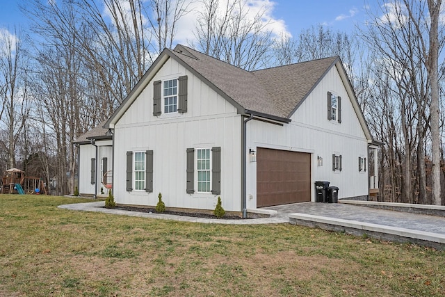 view of property exterior with a garage and a yard