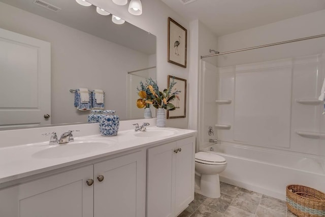 full bathroom featuring vanity, toilet, and washtub / shower combination