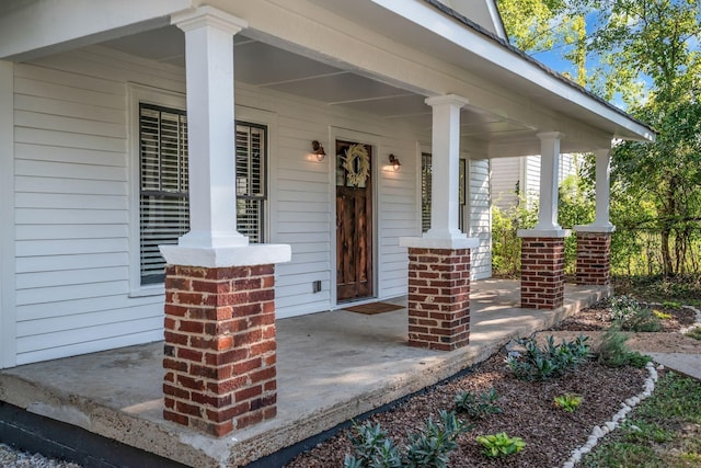 property entrance featuring covered porch