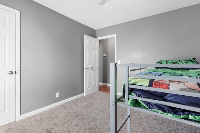 bedroom with ceiling fan and carpet