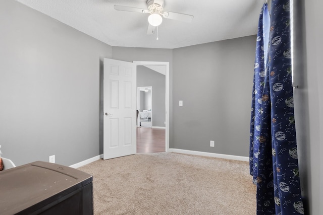 interior space with ceiling fan