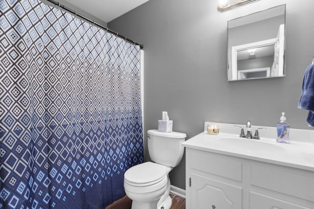 bathroom with vanity, a shower with curtain, and toilet