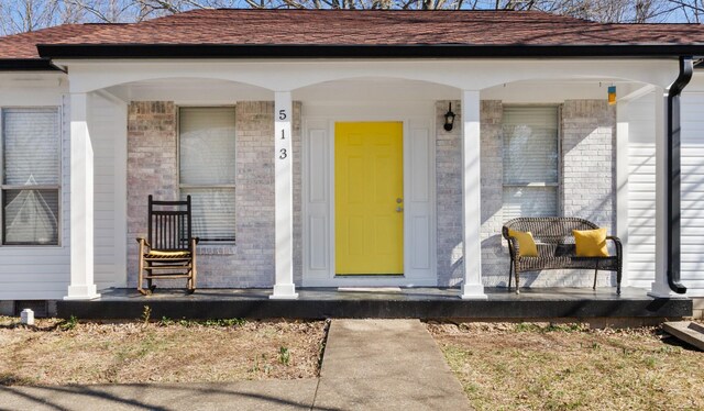 entrance to property with a porch