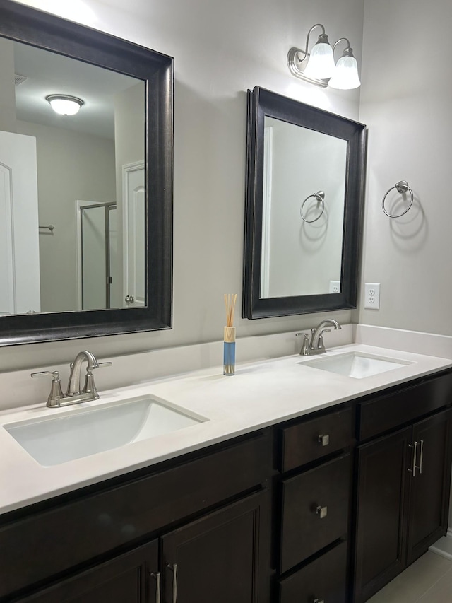 full bathroom featuring double vanity and a sink