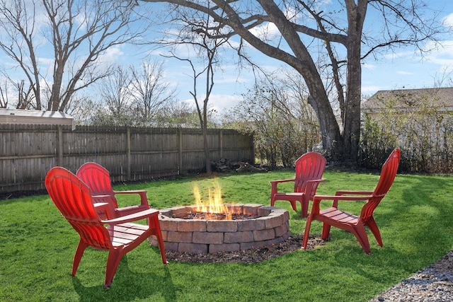 view of yard with a fire pit