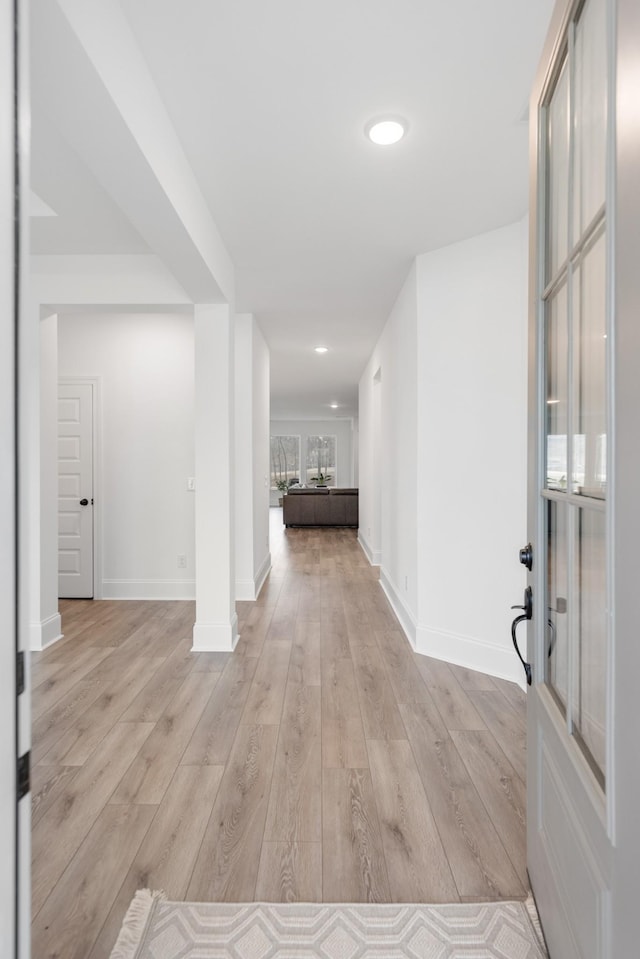 hallway with light wood-type flooring