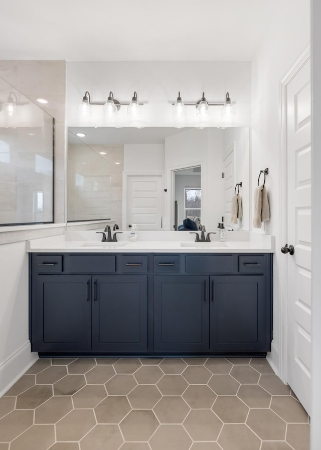 bathroom with vanity and walk in shower