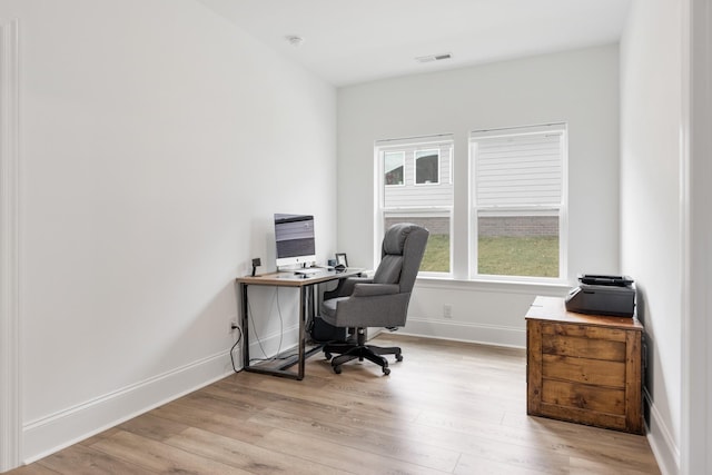 office space featuring light wood-type flooring