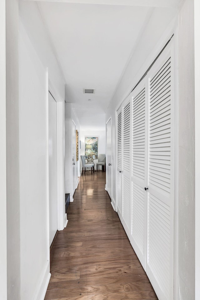 hall featuring dark wood-type flooring