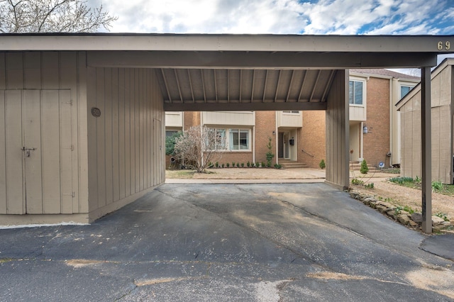 view of parking / parking lot with a carport