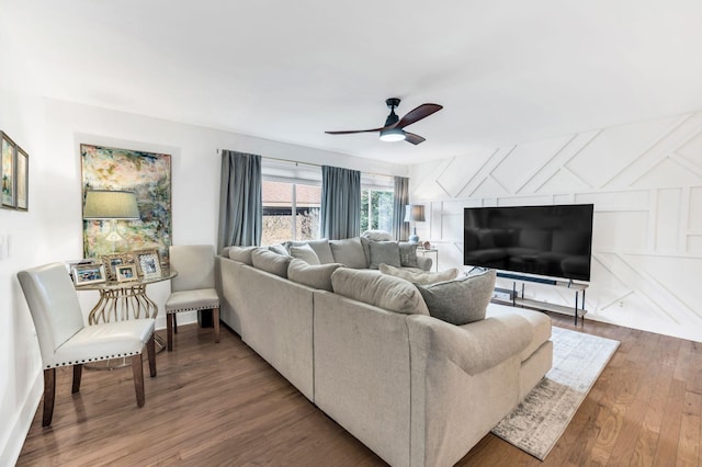 living room with hardwood / wood-style flooring and ceiling fan