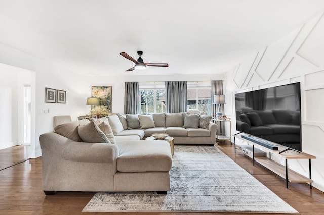 living room featuring dark hardwood / wood-style floors and ceiling fan