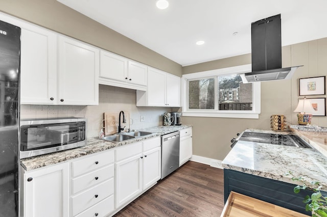 kitchen featuring dark hardwood / wood-style floors, island range hood, white cabinetry, sink, and stainless steel appliances