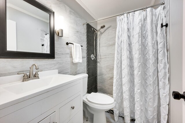 bathroom with crown molding, tile walls, vanity, a shower with curtain, and toilet