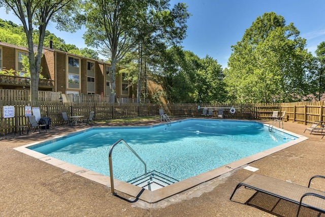 view of swimming pool with a patio area