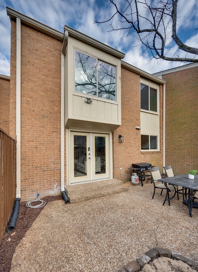 back of house featuring a patio area and french doors