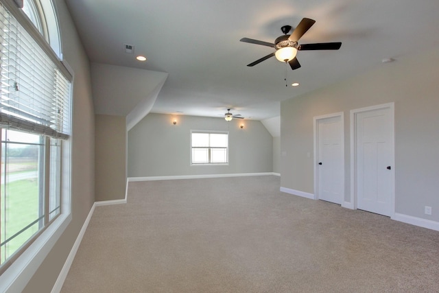 bonus room featuring light carpet and lofted ceiling