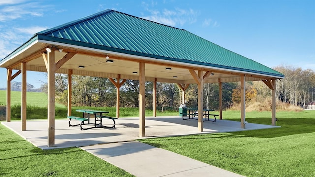 surrounding community featuring a yard, a gazebo, and a patio area