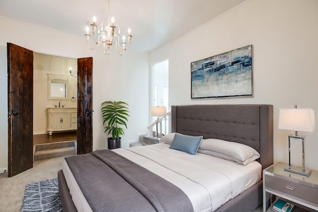 carpeted bedroom with an inviting chandelier, ensuite bath, ornamental molding, and sink