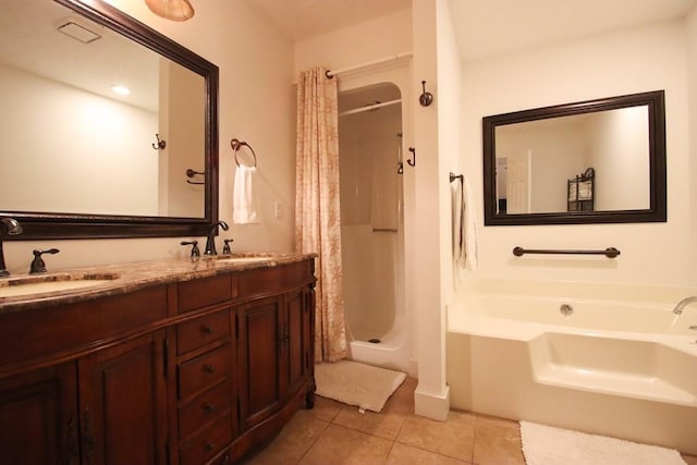 bathroom featuring vanity, tile patterned floors, and separate shower and tub