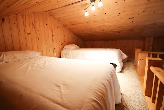 bedroom with light carpet, wooden walls, wooden ceiling, and lofted ceiling