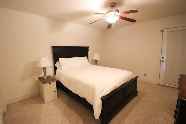 bedroom with light carpet and ceiling fan