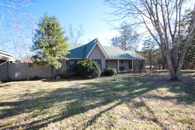 view of side of property with a yard