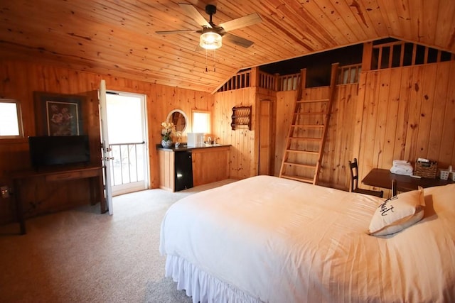 carpeted bedroom featuring lofted ceiling, wooden ceiling, and wood walls