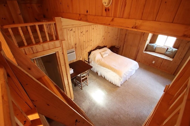 bedroom with a wall mounted AC and wooden walls