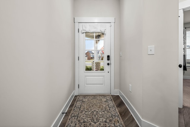 entryway with dark hardwood / wood-style floors