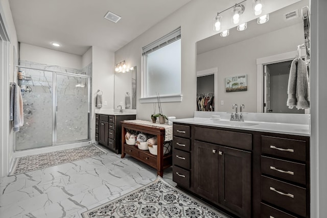 bathroom with vanity and walk in shower