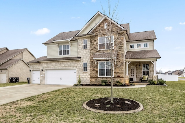 view of front of house with a garage, a front yard, and covered porch