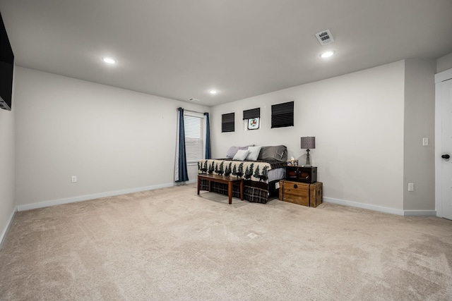 bedroom featuring light carpet