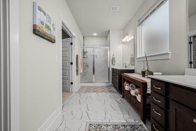 bathroom with an enclosed shower and vanity