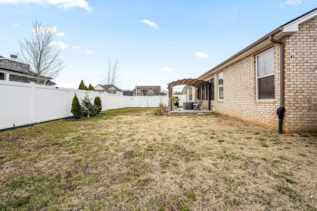 view of yard with a pergola and a patio