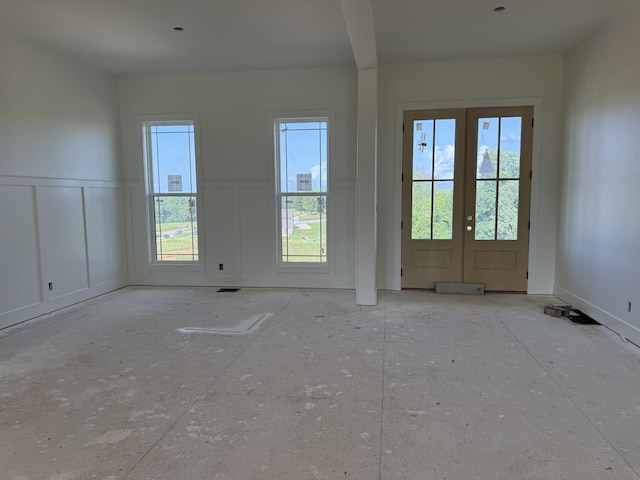 3944 Chapel Hill Rd, Clarksville, TN 37040 - empty room featuring a decorative wall, a wainscoted wall, and french doors
