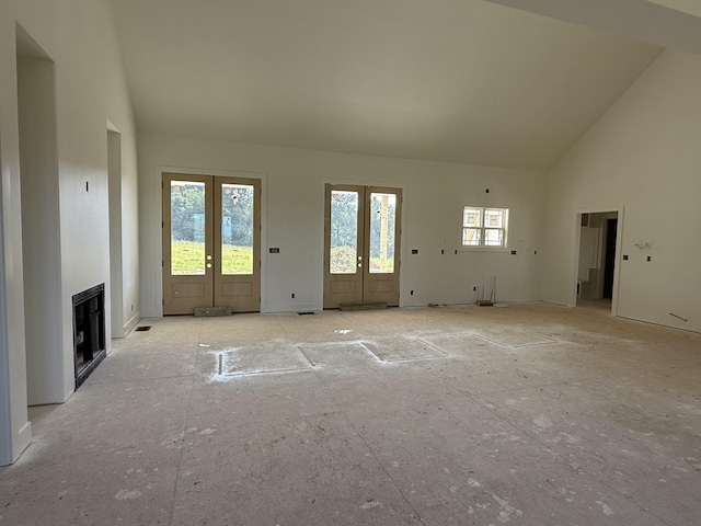 3944 Chapel Hill Rd, Clarksville, TN 37040 - unfurnished living room with high vaulted ceiling, french doors, and a fireplace