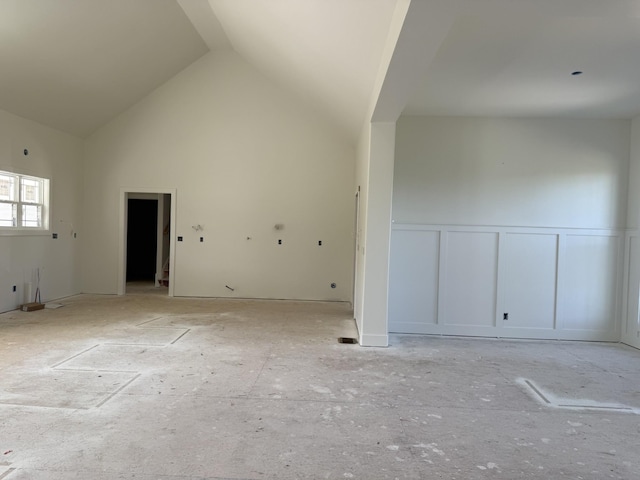3944 Chapel Hill Rd, Clarksville, TN 37040 - empty room featuring a decorative wall, a wainscoted wall, and high vaulted ceiling