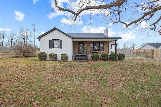 single story home featuring a front lawn and covered porch