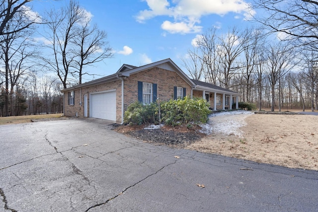 view of side of home featuring a garage